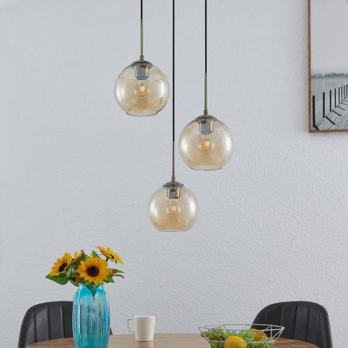 Lindby Jurian závesná lampa jantár, mosadz 3-pl.