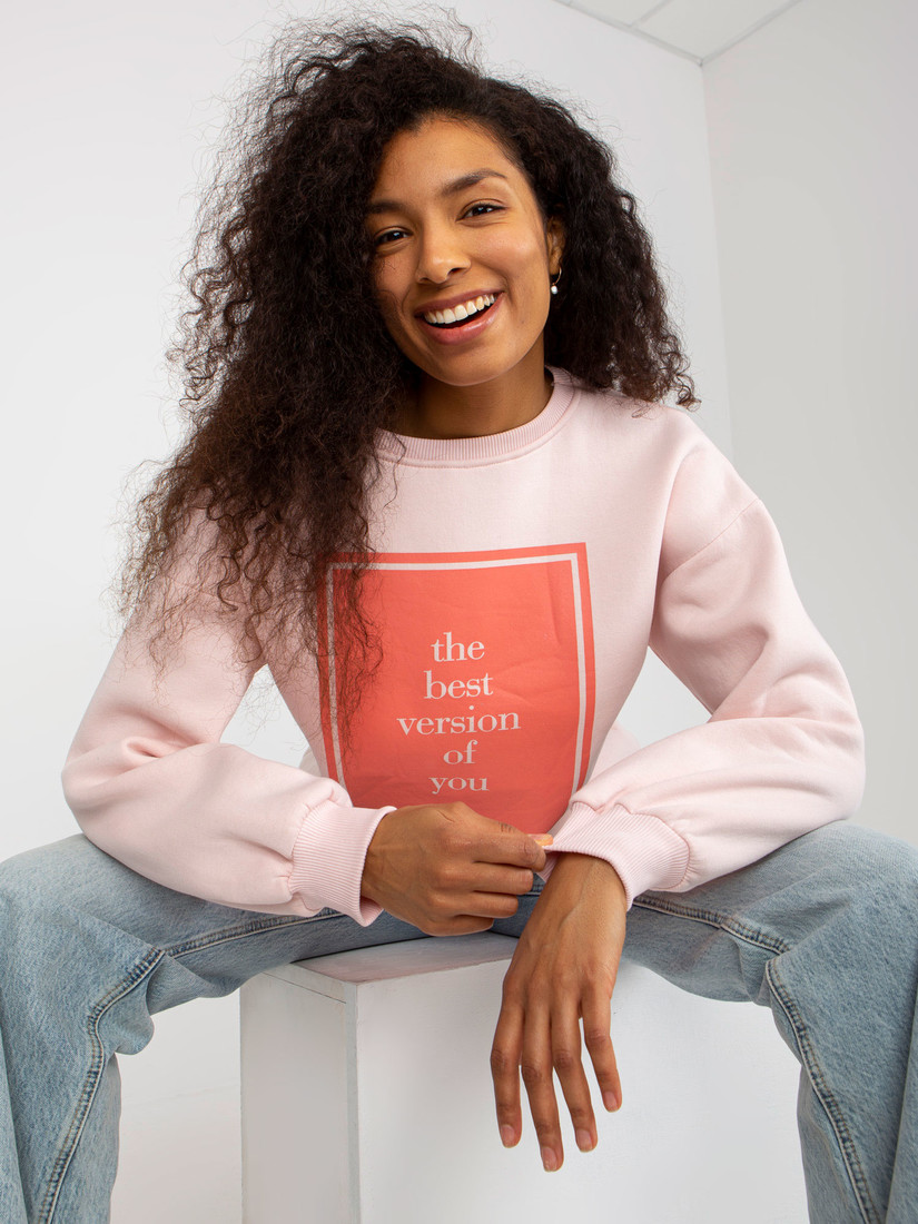 Light pink oversized sweatshirt with a printed design