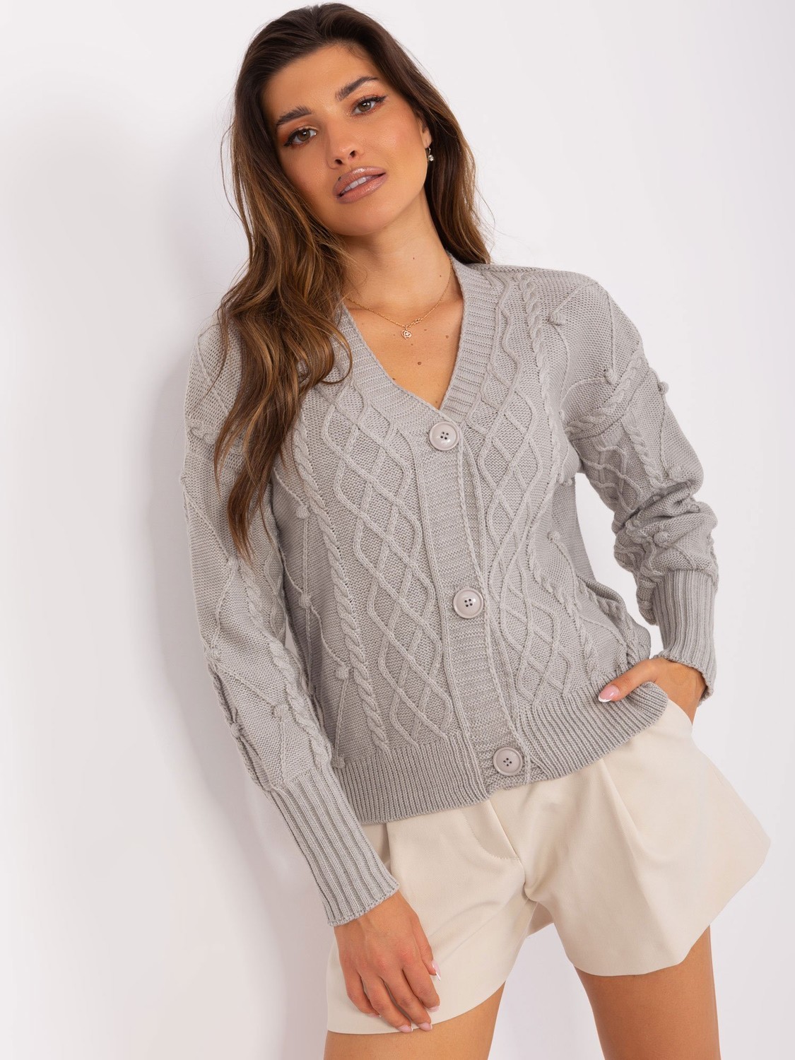 Gray women's sweater with braids