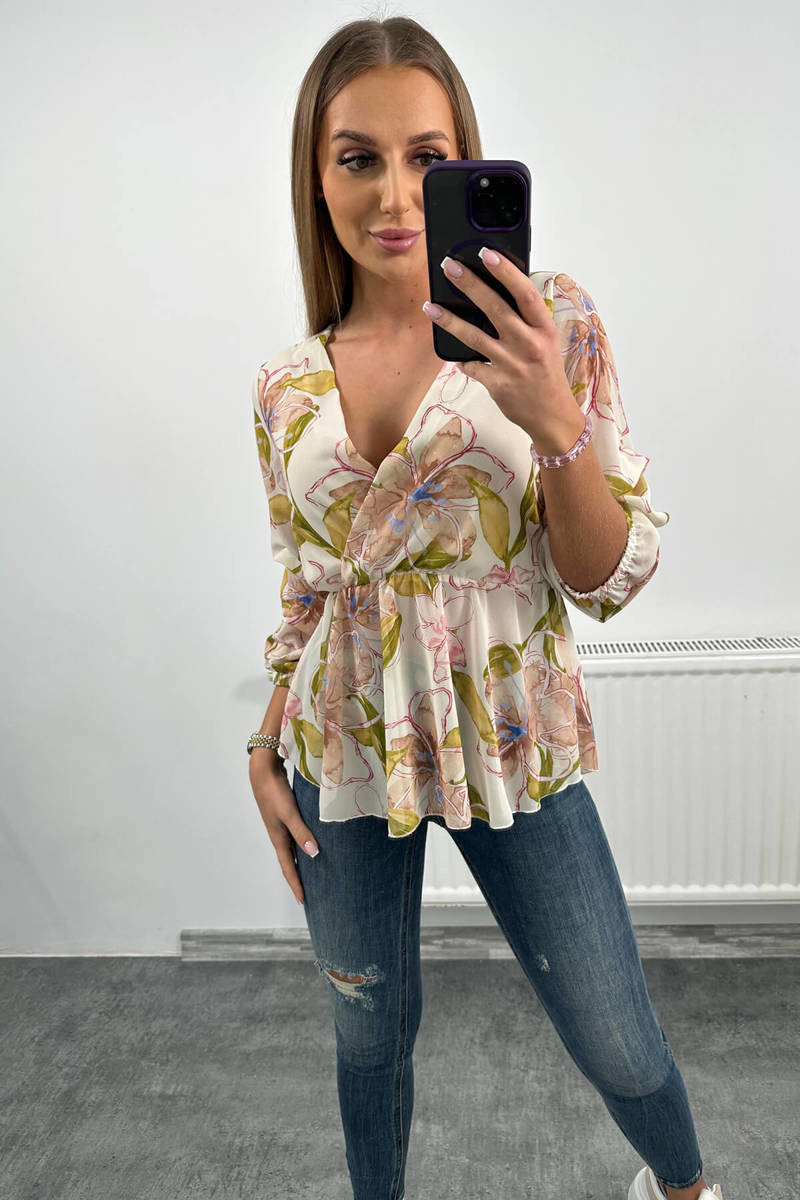 Blouse with floral motif of beige color