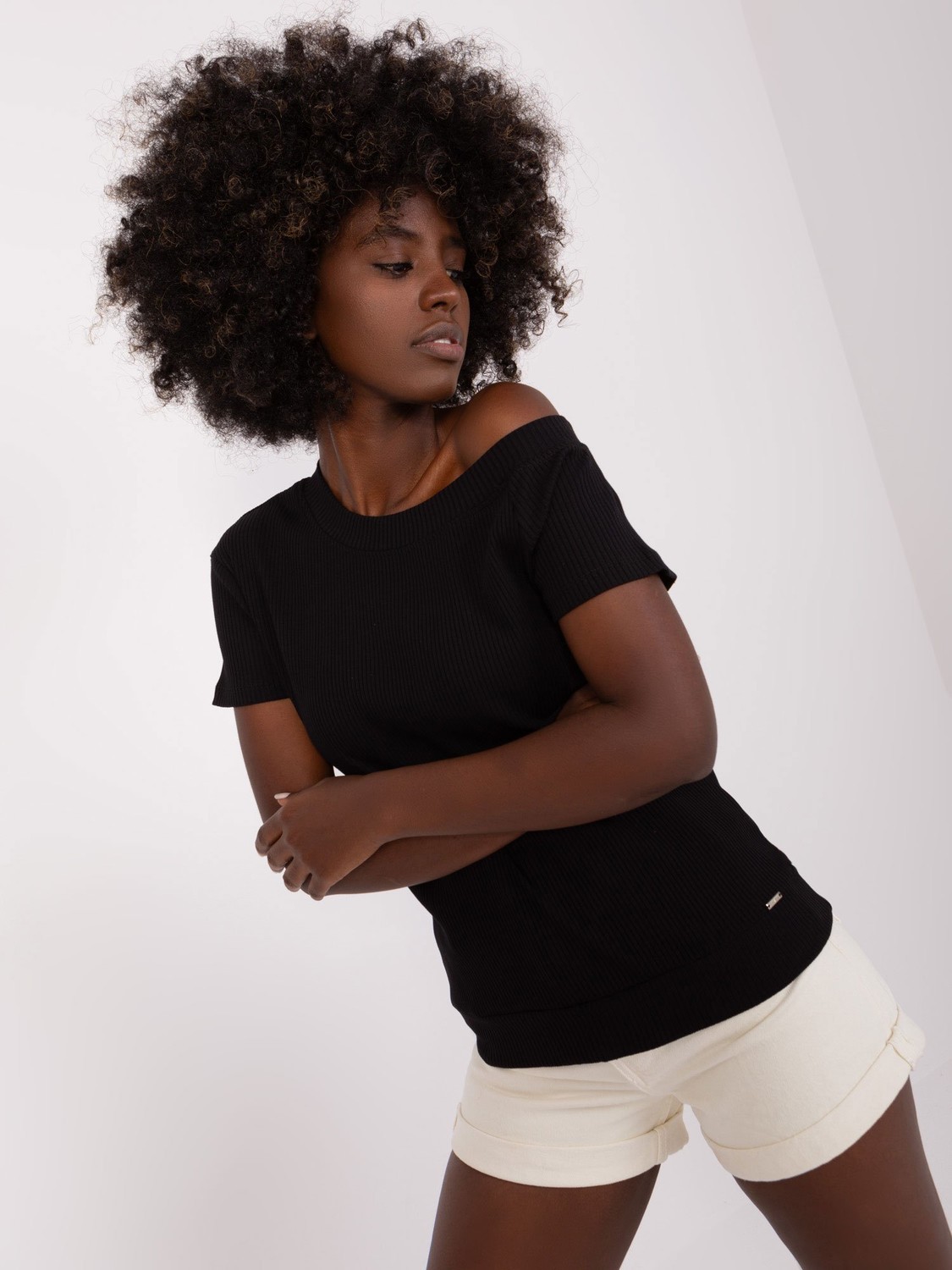 Basic black blouse with asymmetrical neckline