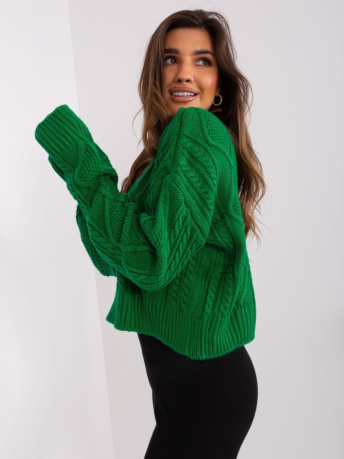 Green loose sweater with cables