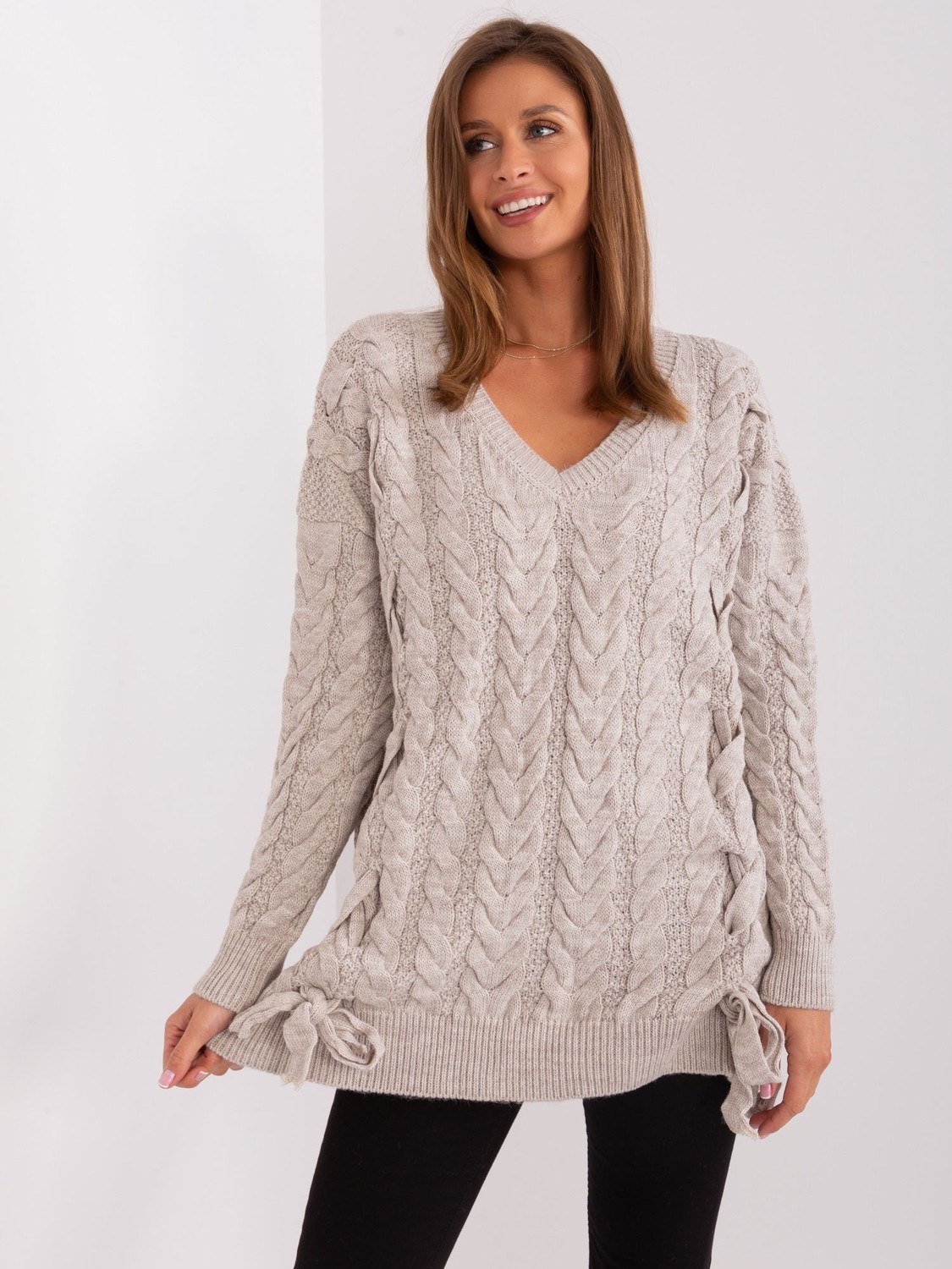 Beige women's sweater with cables