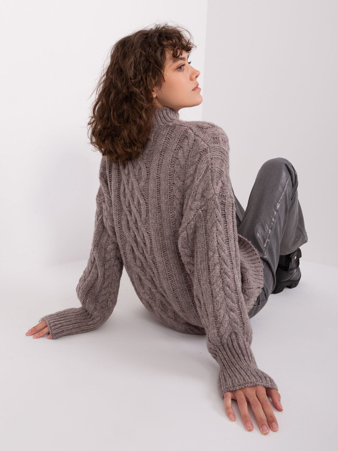 Dark gray women's sweater with cable knits