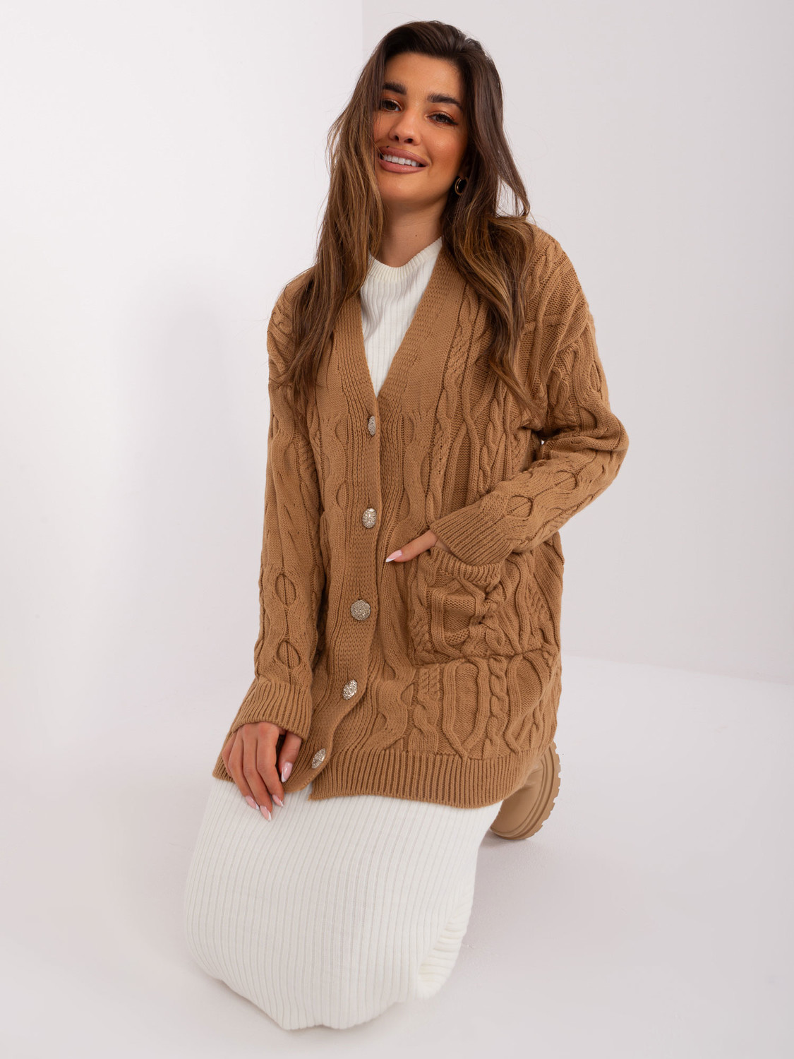 Camel sweater with cable patterns