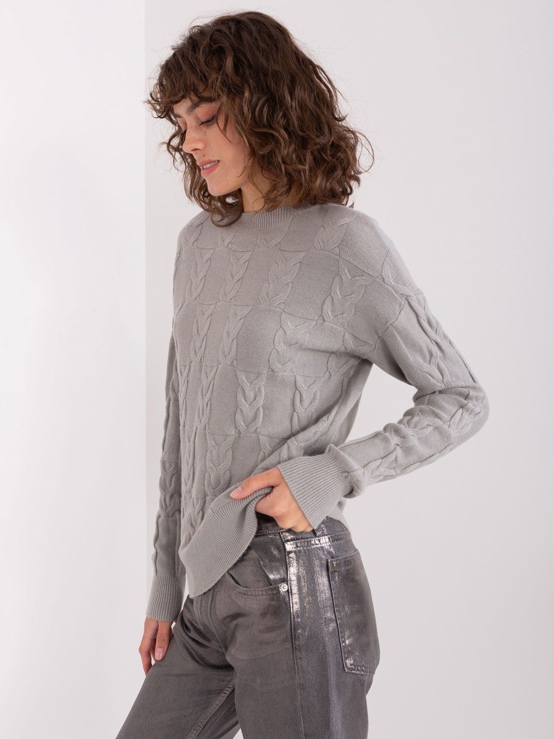 Grey knitted sweater with cables