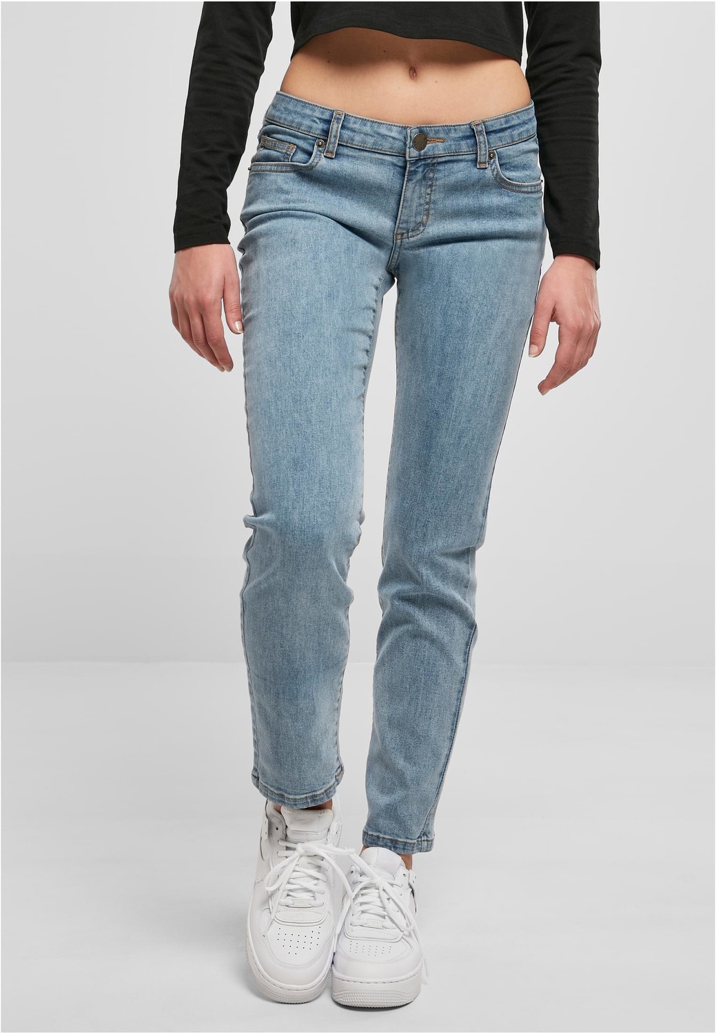 Women's straight denim trousers with a low waist dyed in light blue washed