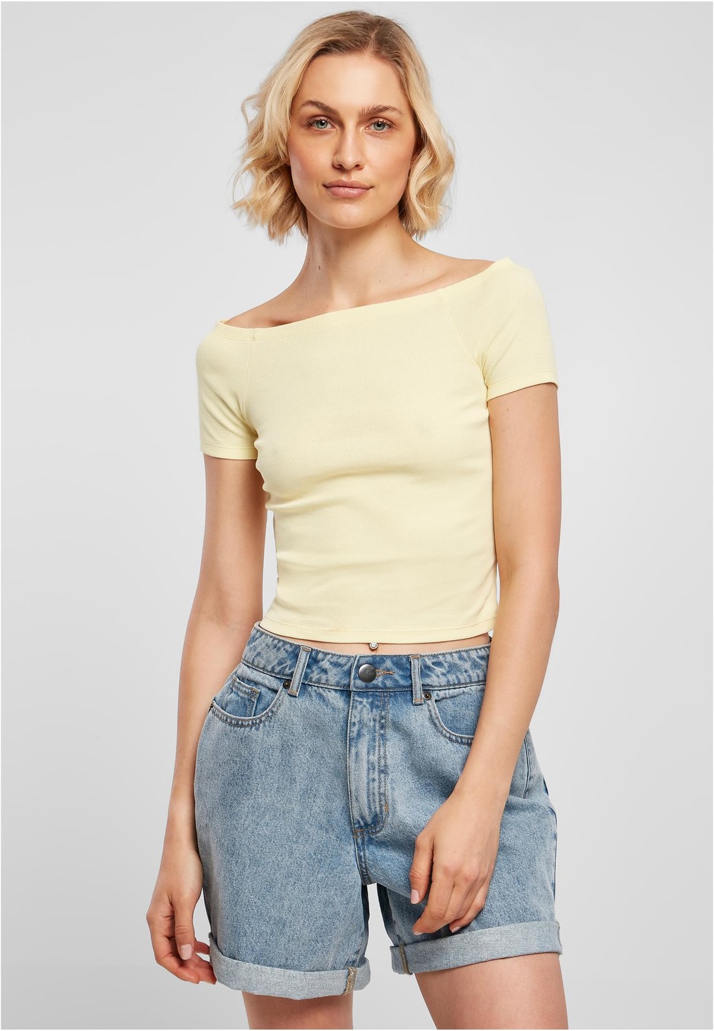 Women's T-shirt with a loose shoulder in soft yellow color