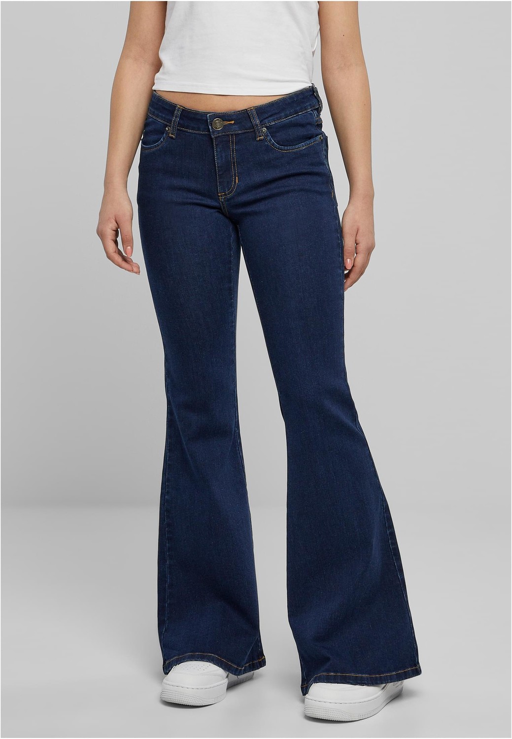 Women's organic washed denim with a low waist in the middle of indigo