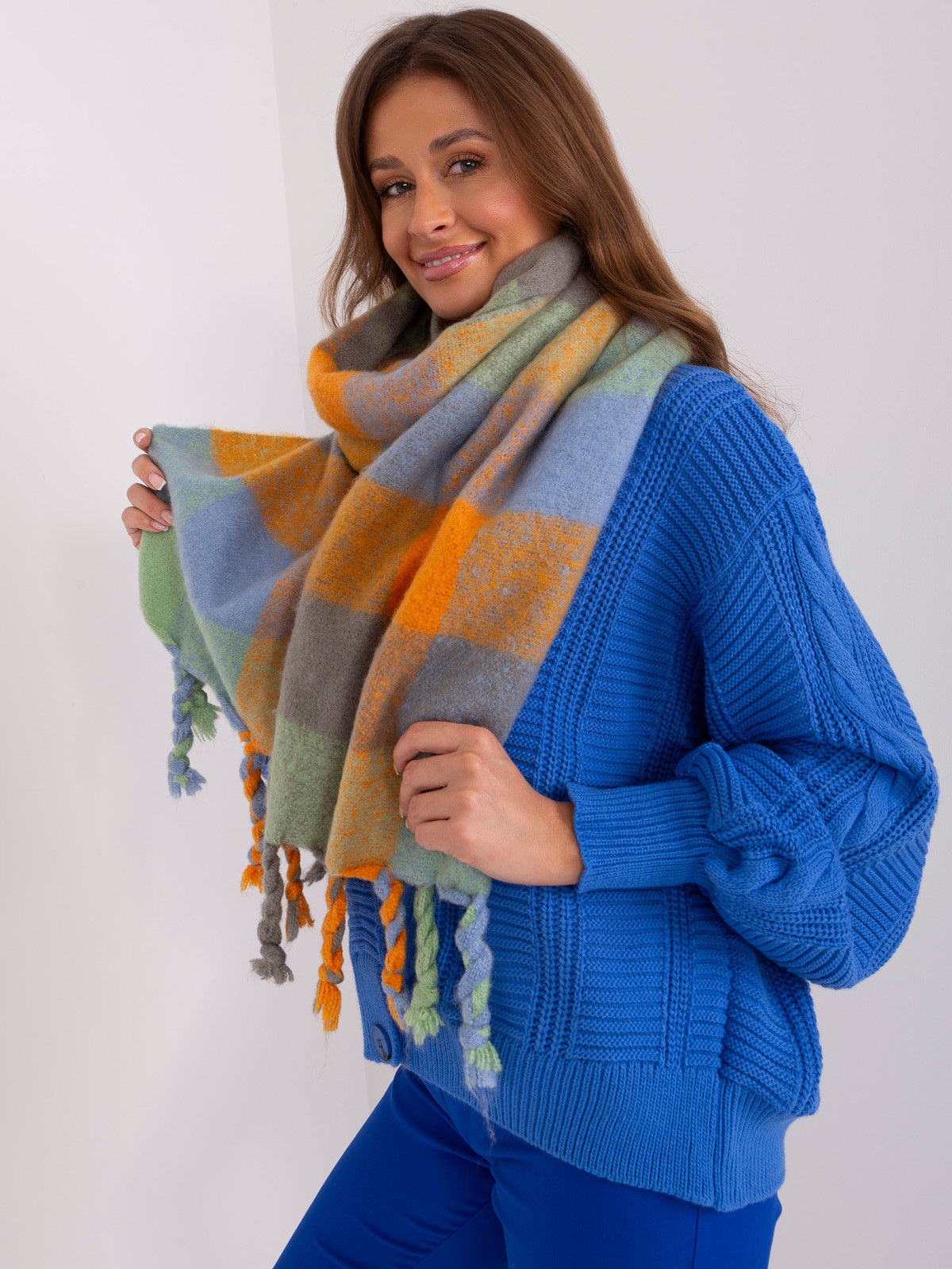 Orange and green scarf with decorative fringe