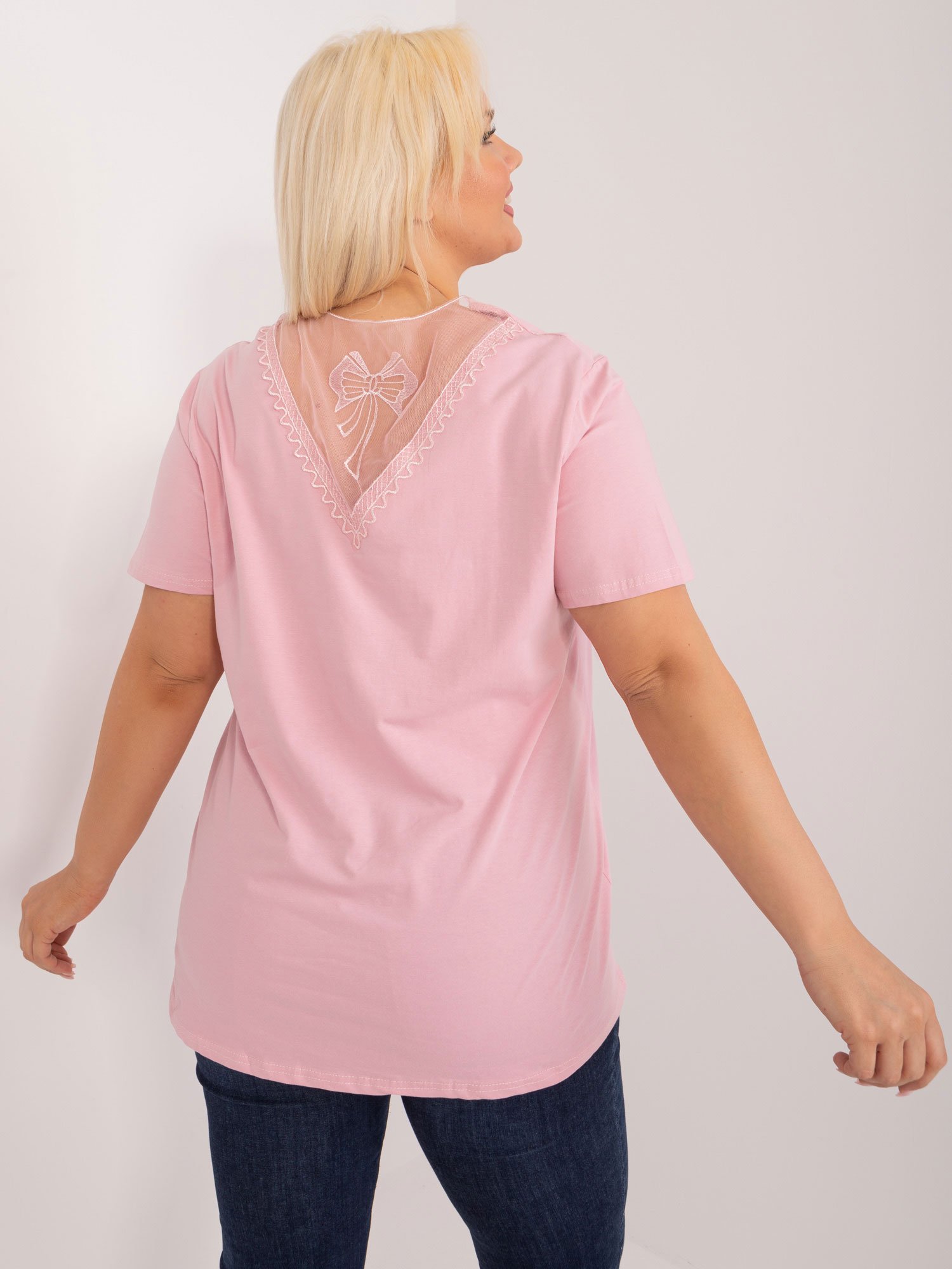 Light pink plus size blouse with a decorative neckline