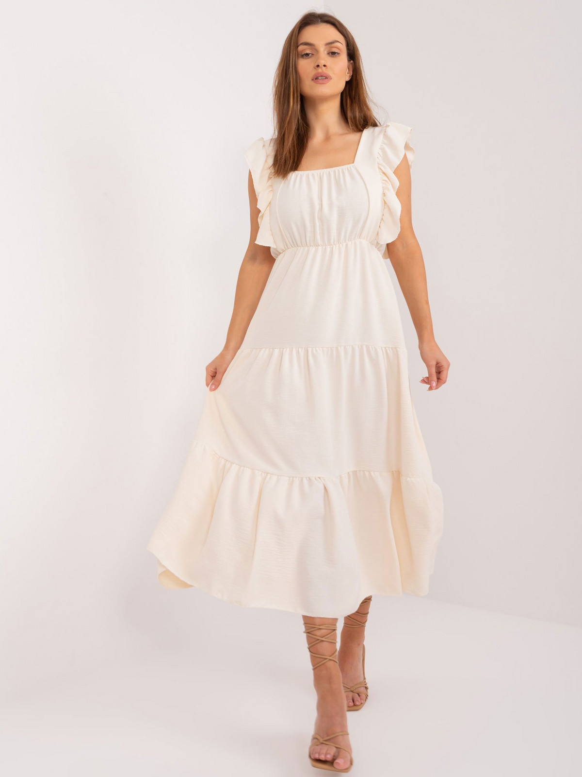 Light beige flared dress with ruffles