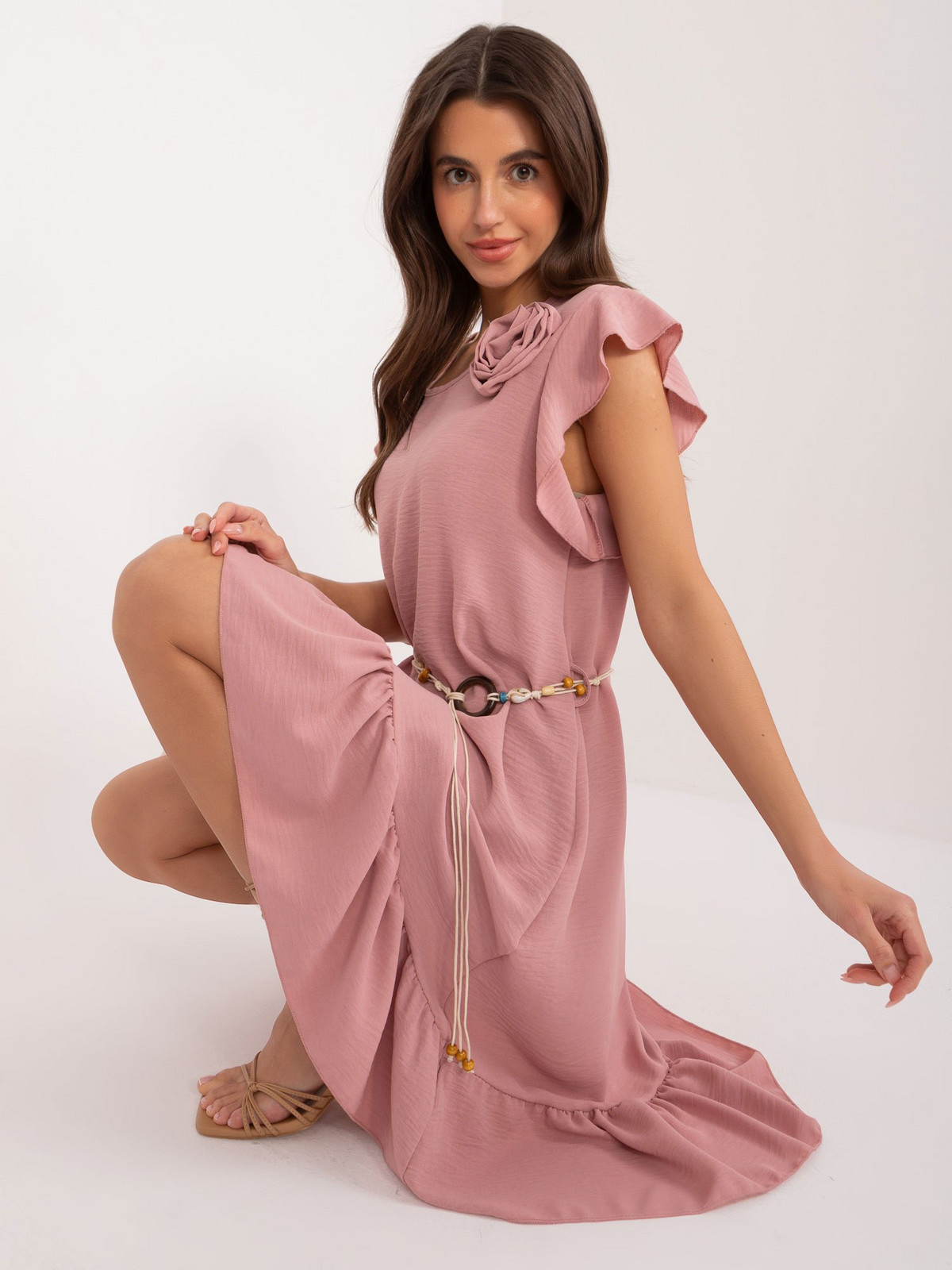 Light beige dress with ruffles and belt