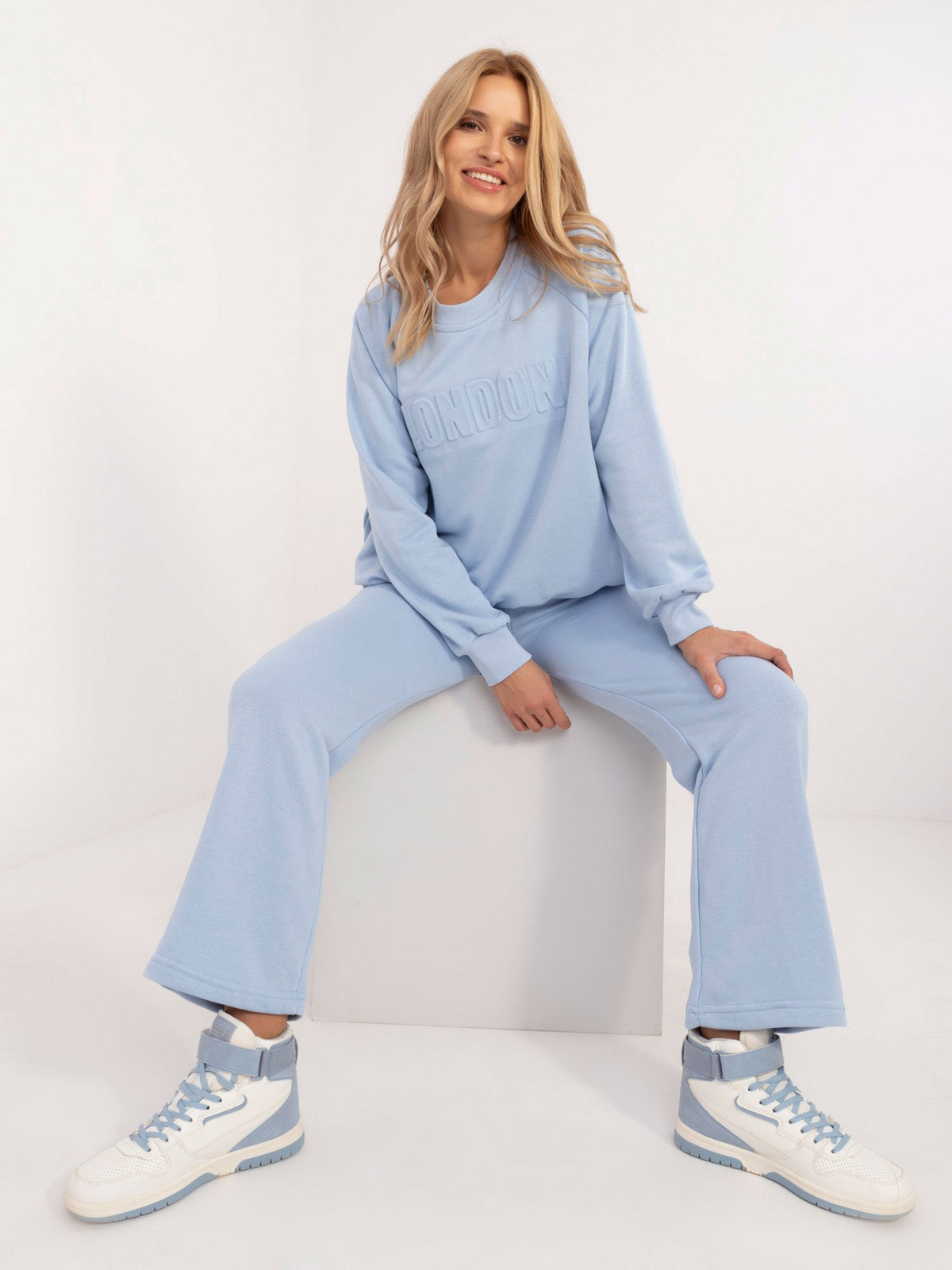 Light blue women's tracksuit with inscription