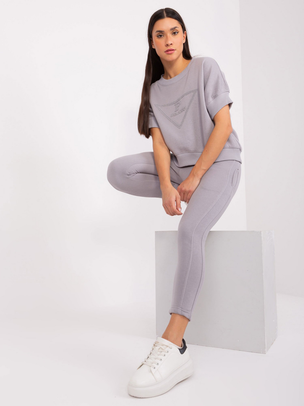 Grey women's tracksuit with patch and insulation