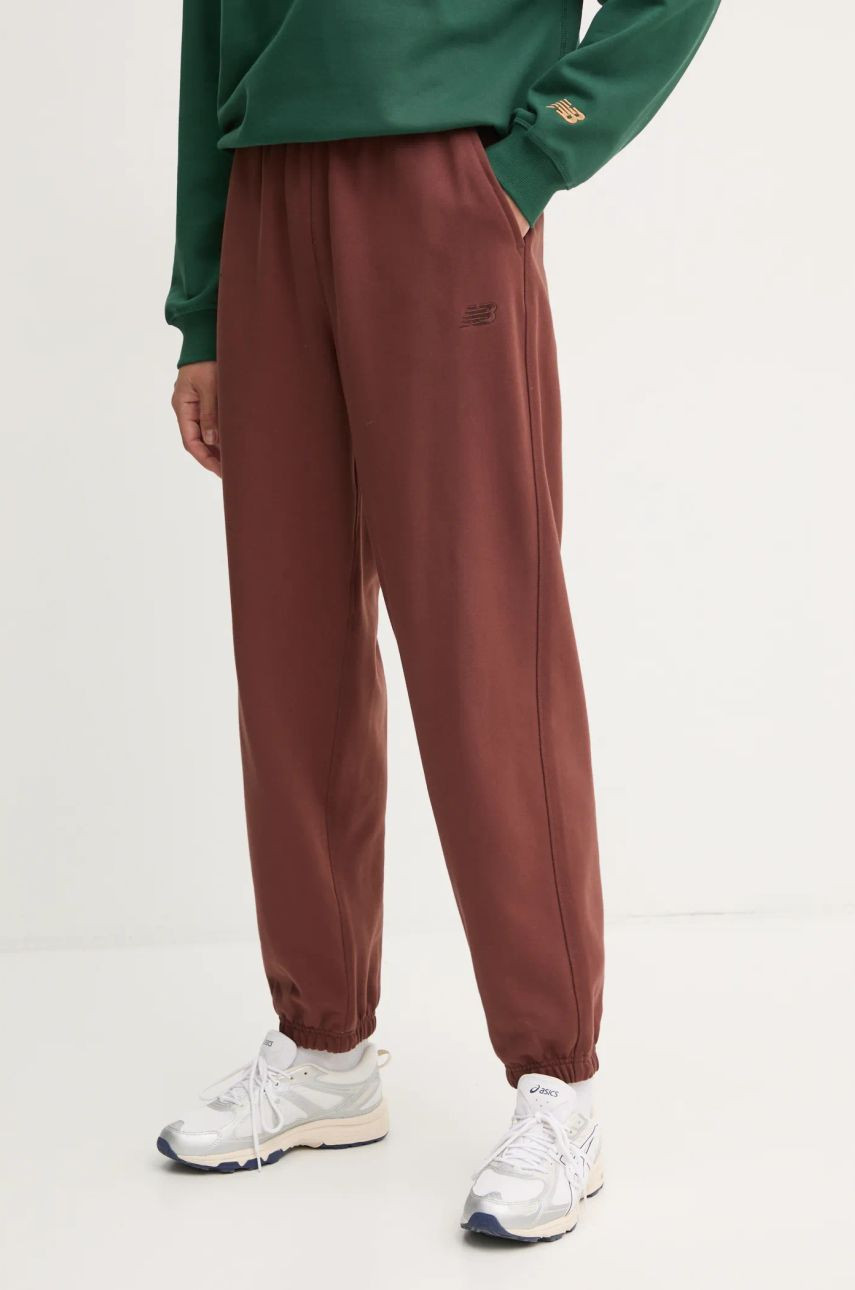 Tepláky New Balance hnedá farba, jednofarebné, WP41513ROK