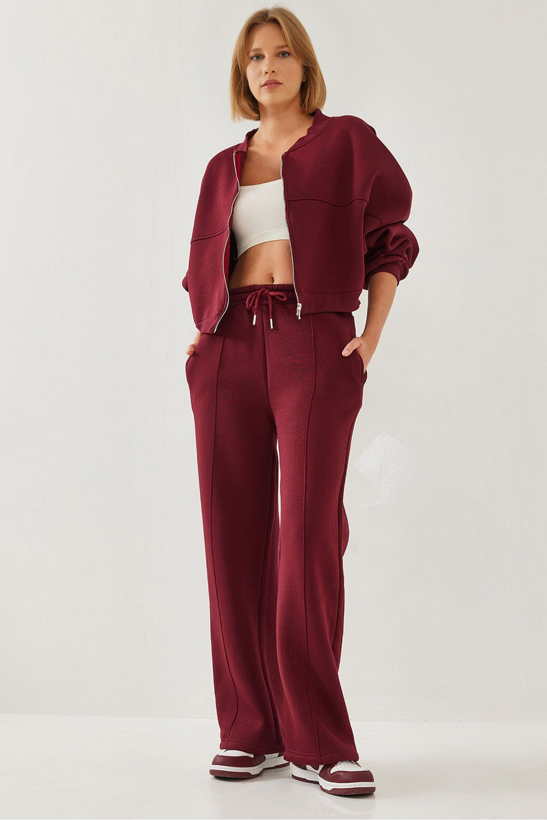 Bianco Lucci Women's Three Thread Zippered Raised Bottom Top Suit
