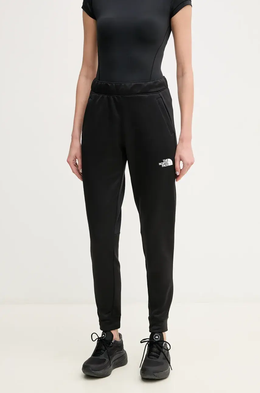Tepláky The North Face Reaxion čierna farba, jednofarebné, NF0A8CNSJK31