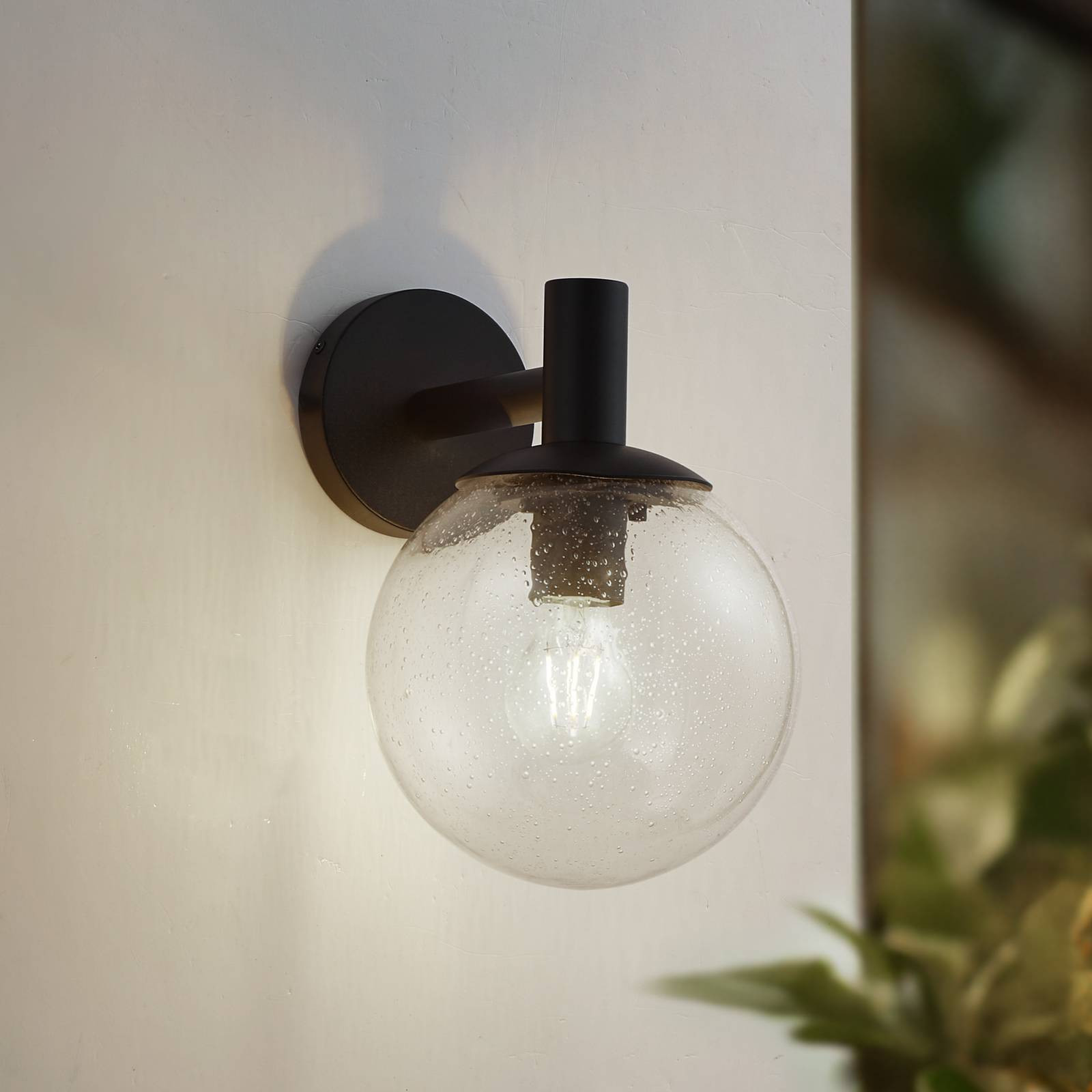 Vonkajšie nástenné svietidlo Lindby Dangan, číre, sklo, Ø 20 cm