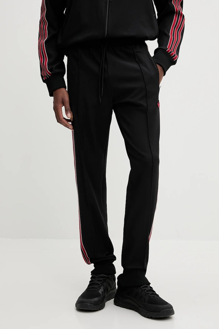 Tepláky adidas Originals MUFC ICON TP čierna farba, s nášivkou, JF0359
