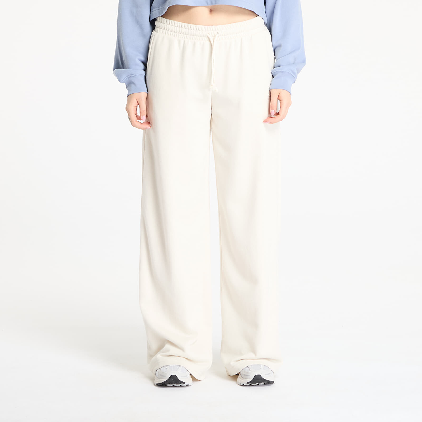 Kalhoty New Balance Coastal Fleece Pant Linen M