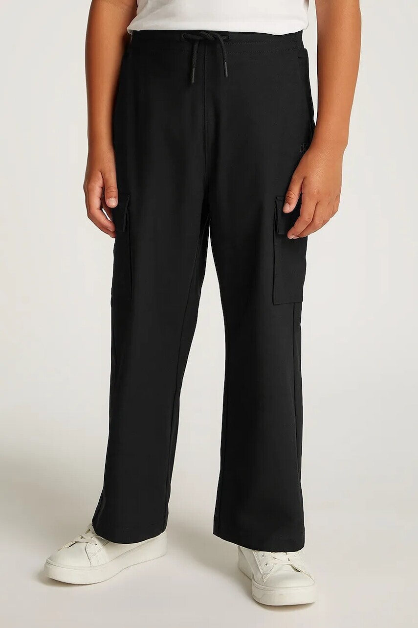 Detské tepláky Calvin Klein Jeans DRY KNIT SKATER čierna farba, jednofarebné, IB0IB02344