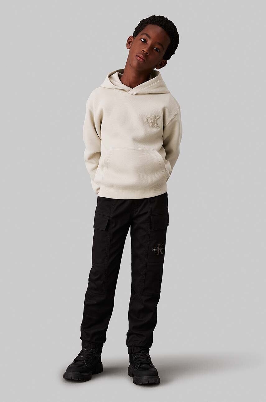 Detské tepláky Calvin Klein Jeans WOVEN CARGO čierna farba, jednofarebné, IB0IB02270