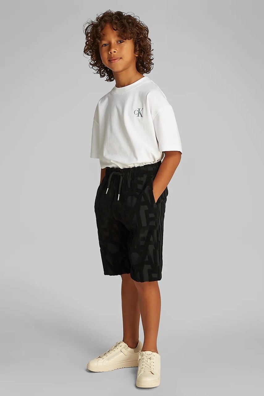 Detské krátke nohavice Calvin Klein Jeans čierna farba, IB0IB02426