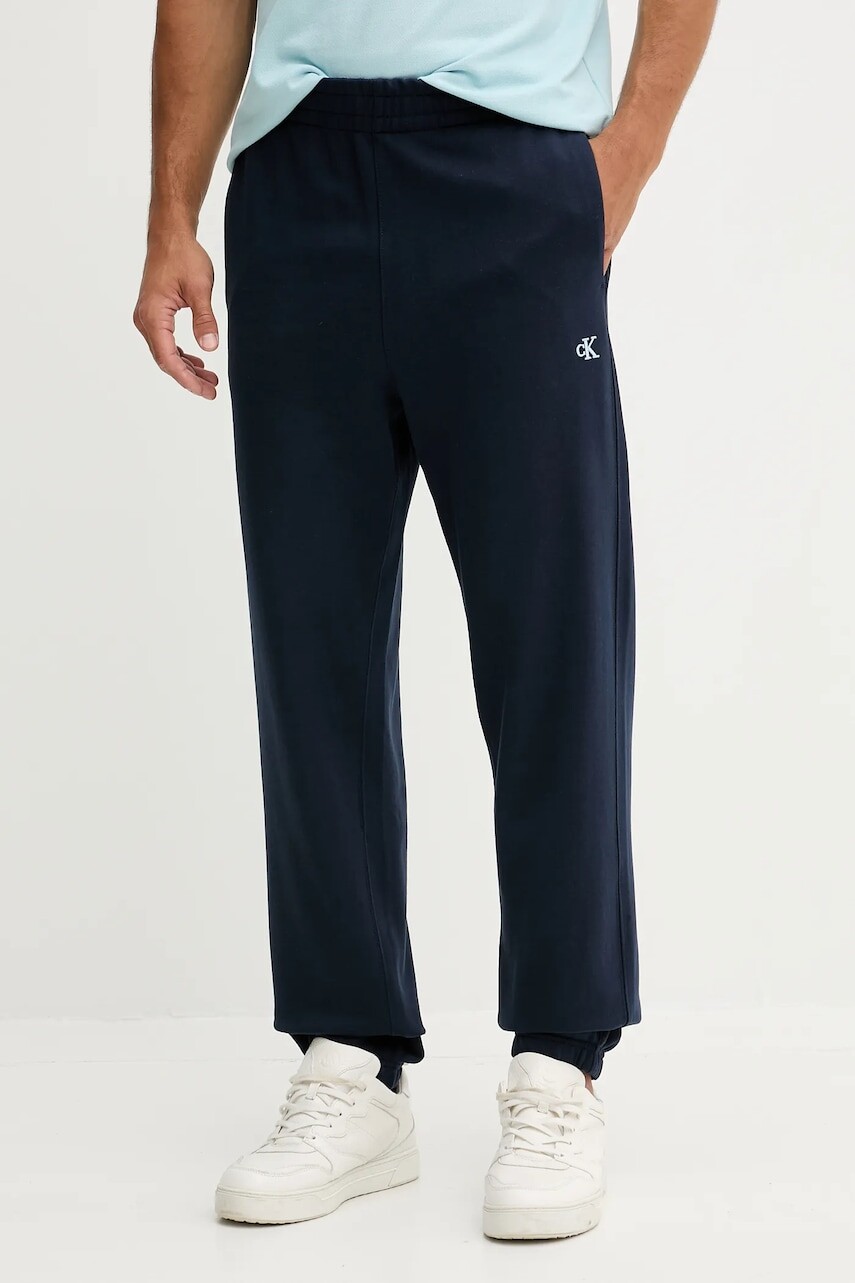 Bavlnené tepláky Calvin Klein Jeans tmavomodrá farba, jednofarebné, LV04RD241G