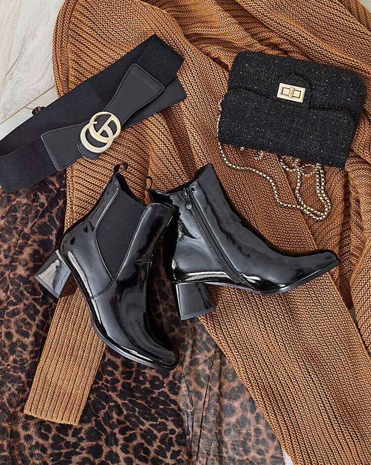 Resti Black women's boots on a low post Nekery