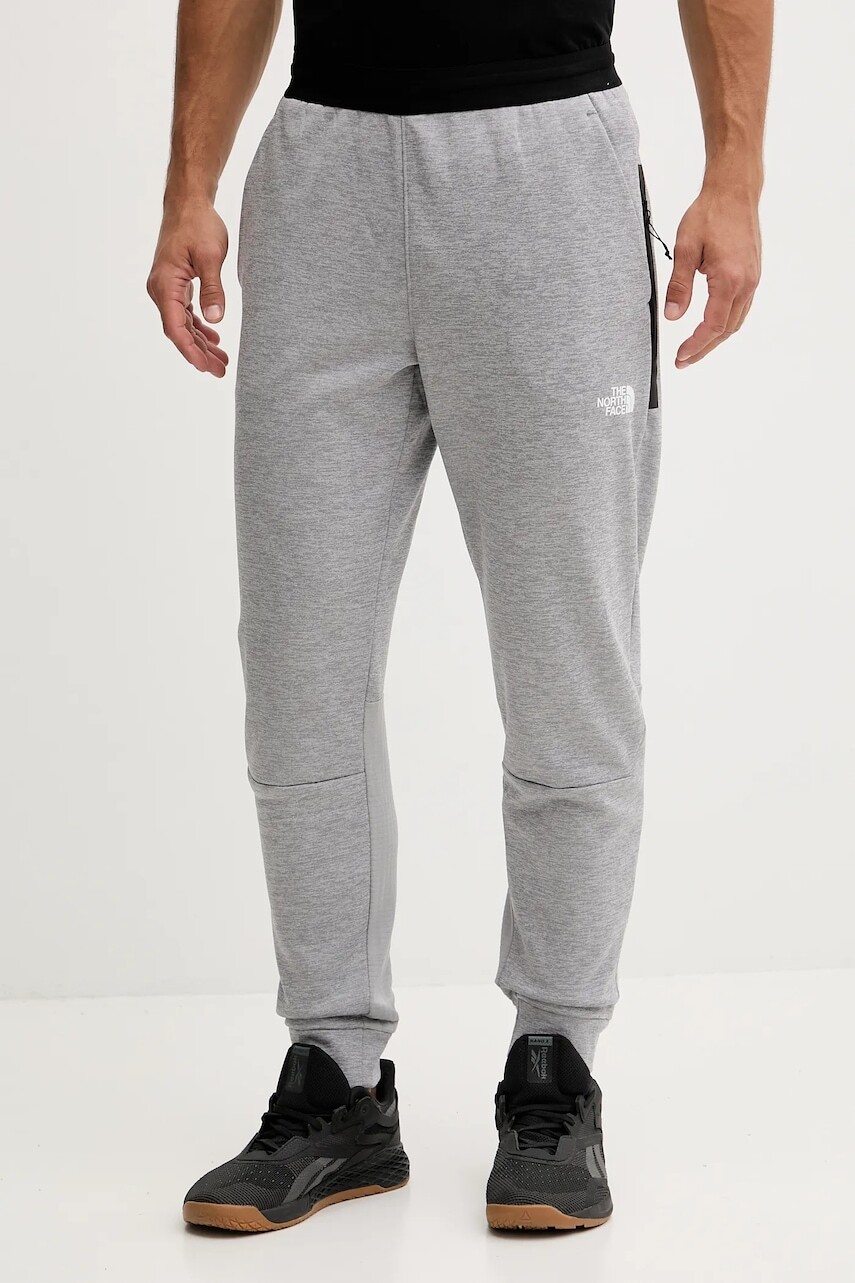 Tréningové nohavice The North Face šedá farba, melanžové, NF0A893SEB91