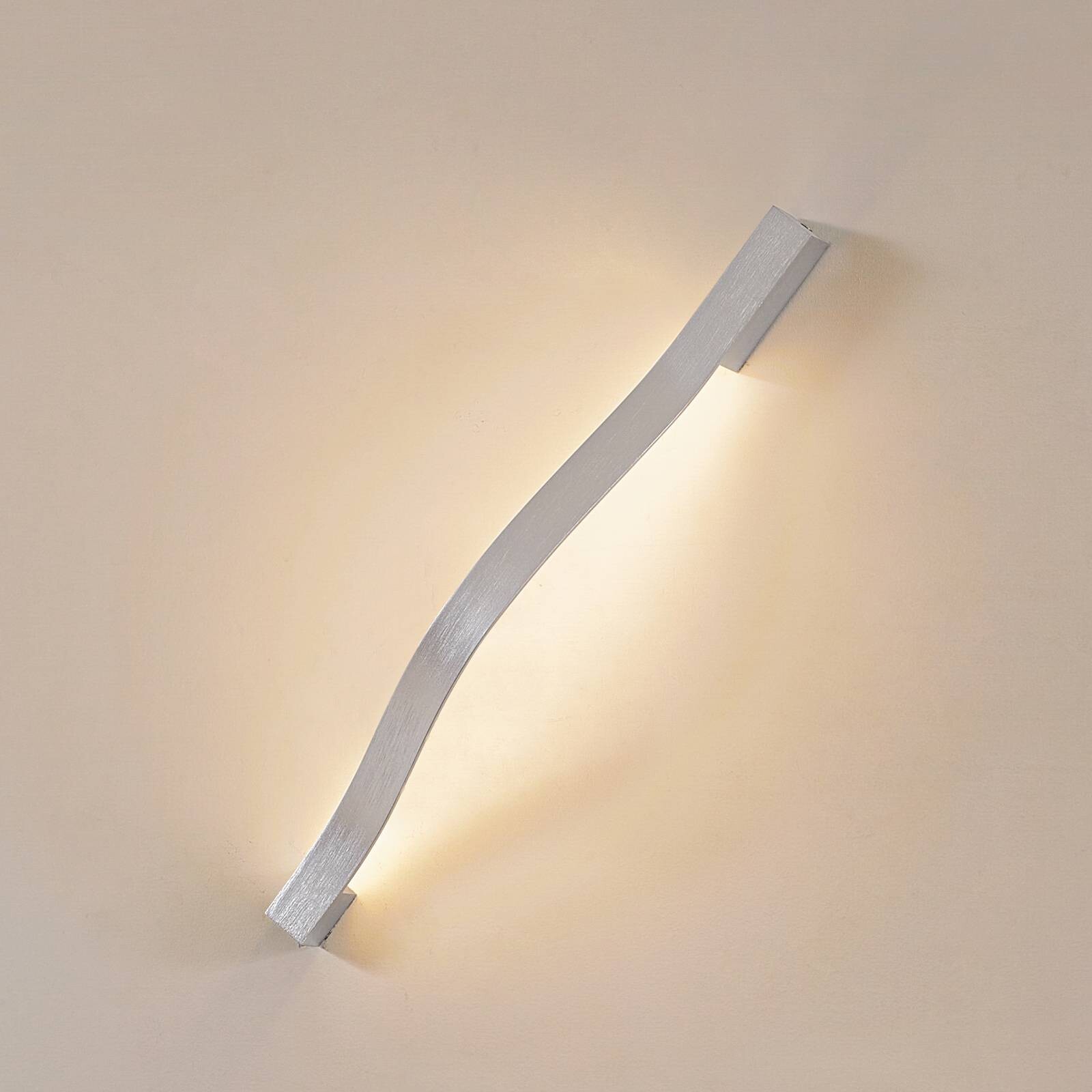 Lindby LED nástenné svetlo Alvon, strieborné, výška 50 cm, kov