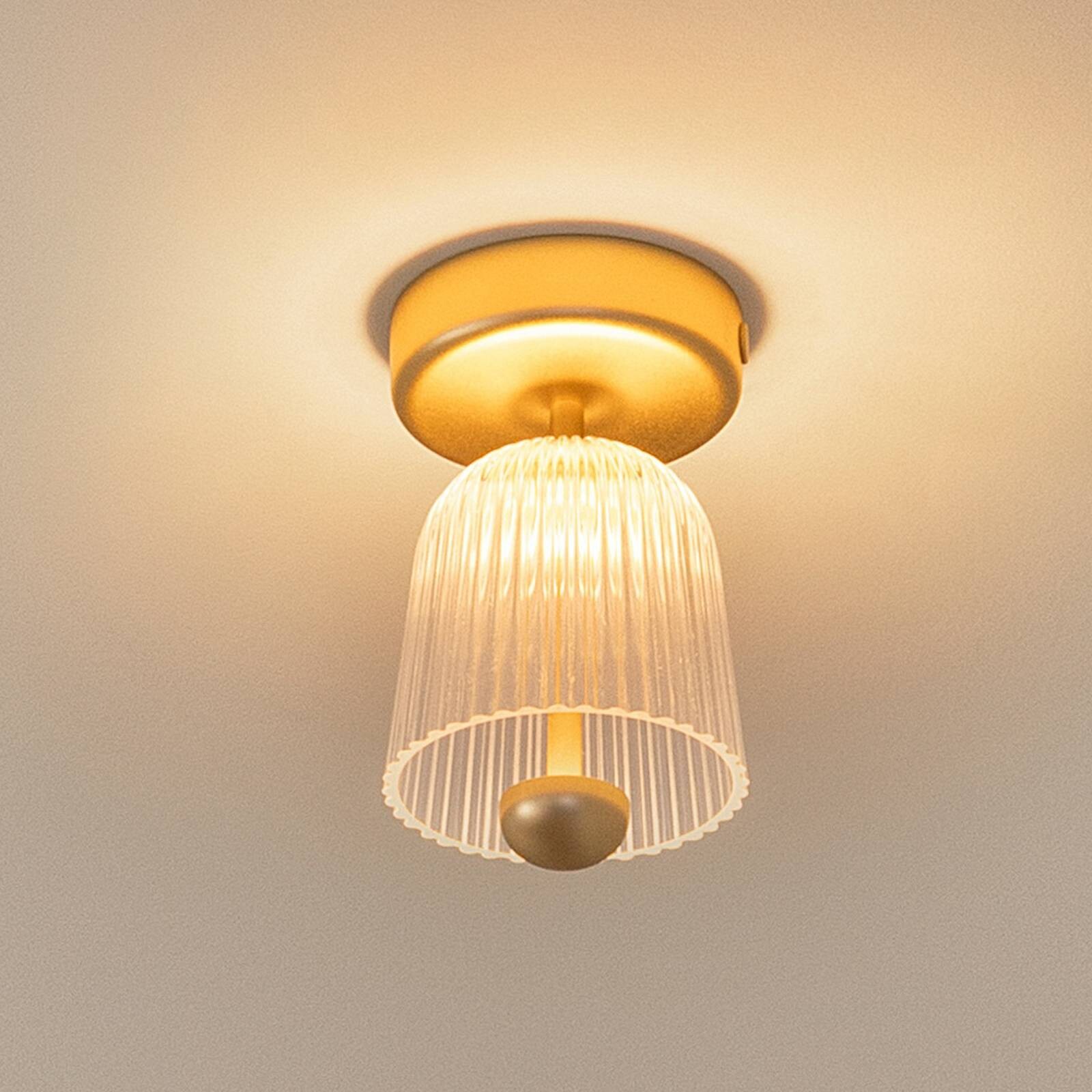 Nuura stropné LED svetlo Asteea, Ø 12 cm, mosadzová farba/číra