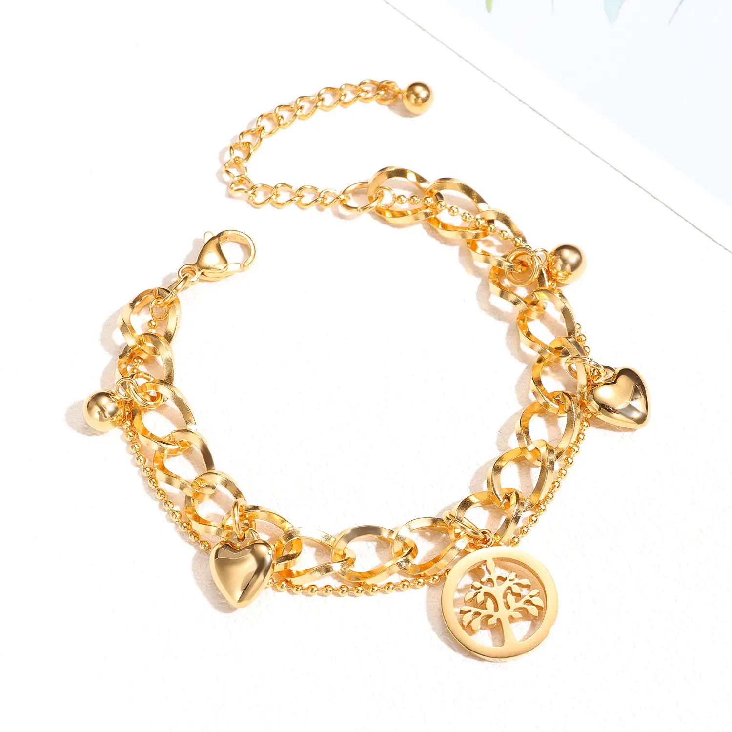 Oceľový náramok - retiazka s príveskami strom života, srdiečka, guličky, zlatá farba