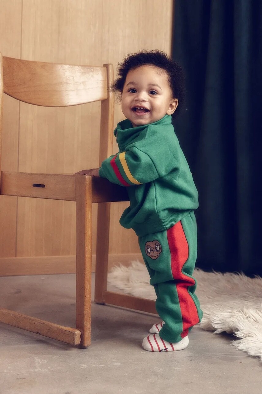 Detské bavlnené tepláky Mini Rodini E.T. zelená farba, s nášivkou, 25830100