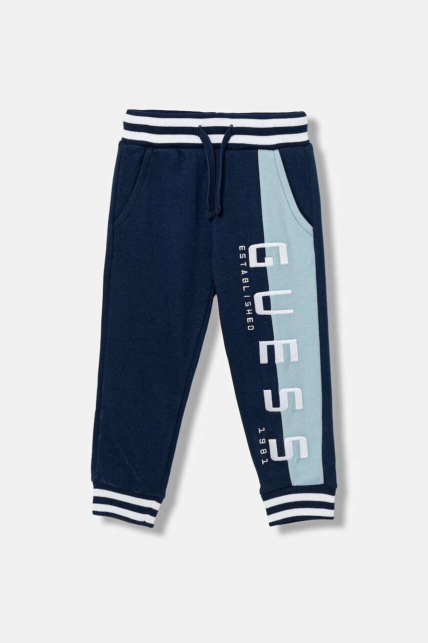 Detské bavlnené tepláky Guess tmavomodrá farba, vzorované, N5BQ13 KAX74