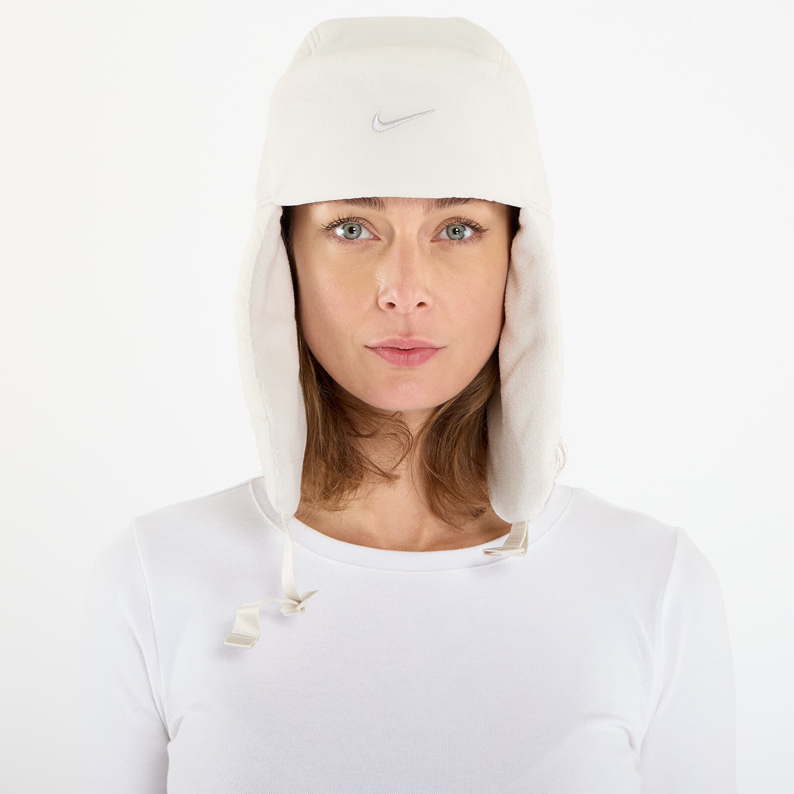 Čiapka Nike Fly Unstructured Puffer Trapper Cap Light Bone/ Light Bone/ Light Bone L/XL