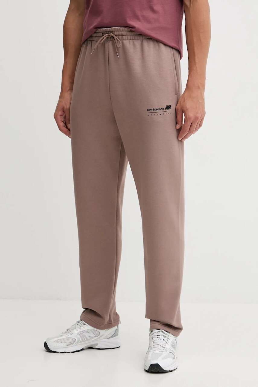 Tepláky New Balance hnedá farba, jednofarebné, MP53508EAS