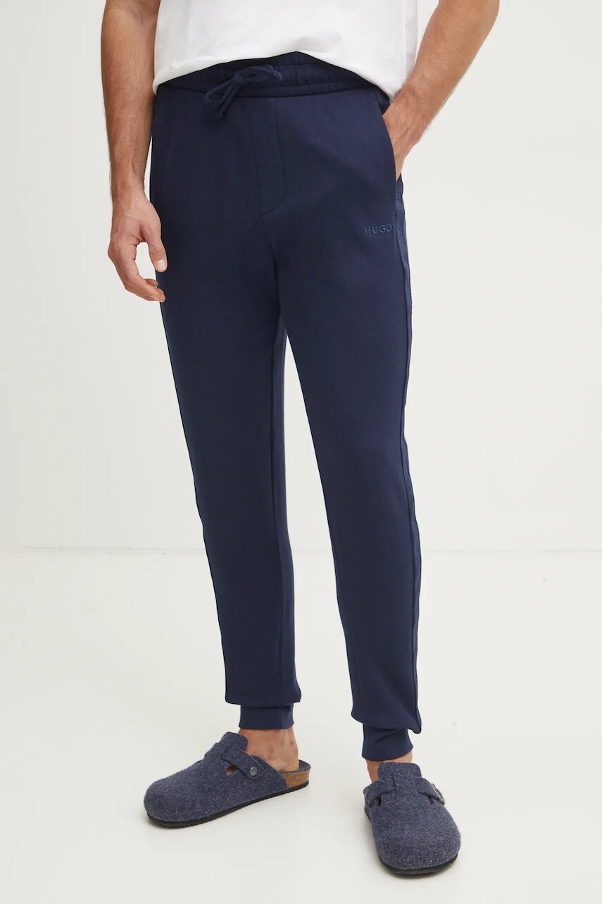 Bavlnené nohavice HUGO tmavomodrá farba, jednofarebné, 50520501