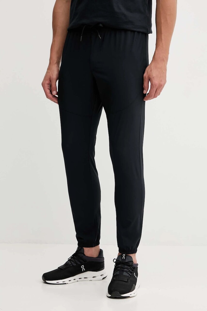 Tepláky Under Armour Vibe Woven čierna farba, jednofarebné, 1386557