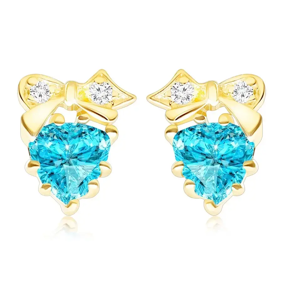 Zlaté náušnice 9K v tvare srdca s modrým topásom a zlatou mašľou