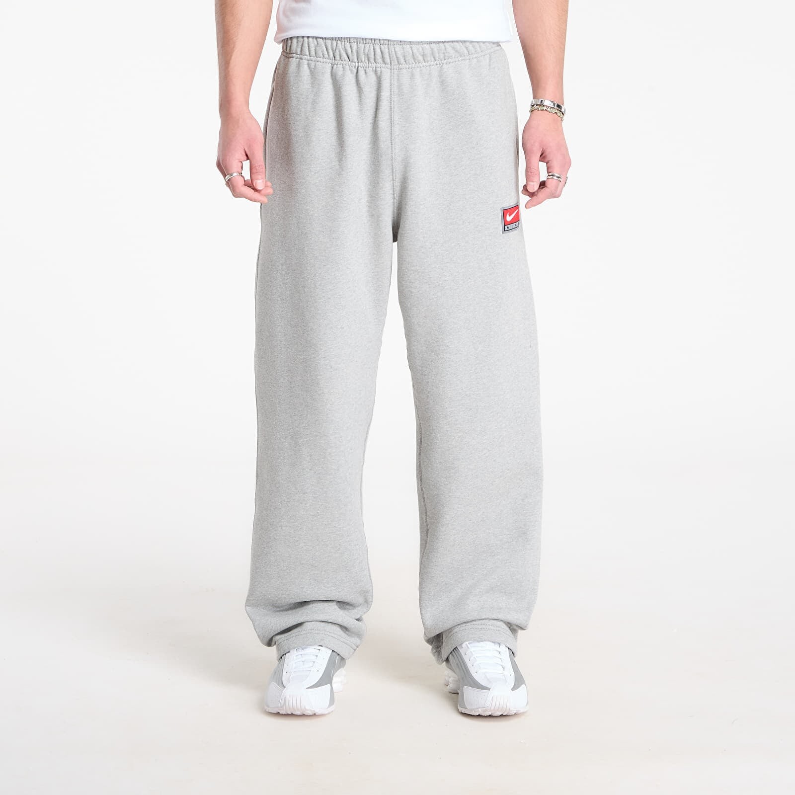 Tepláky Nike Solo Swoosh Men's Fleece Open-Hem Pants Dk Grey Heather/ White XS