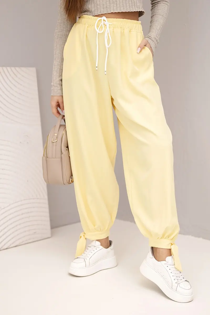 Kesi Włoski Dámske nohavice so širokým nohavkom a viazaním dole žlté