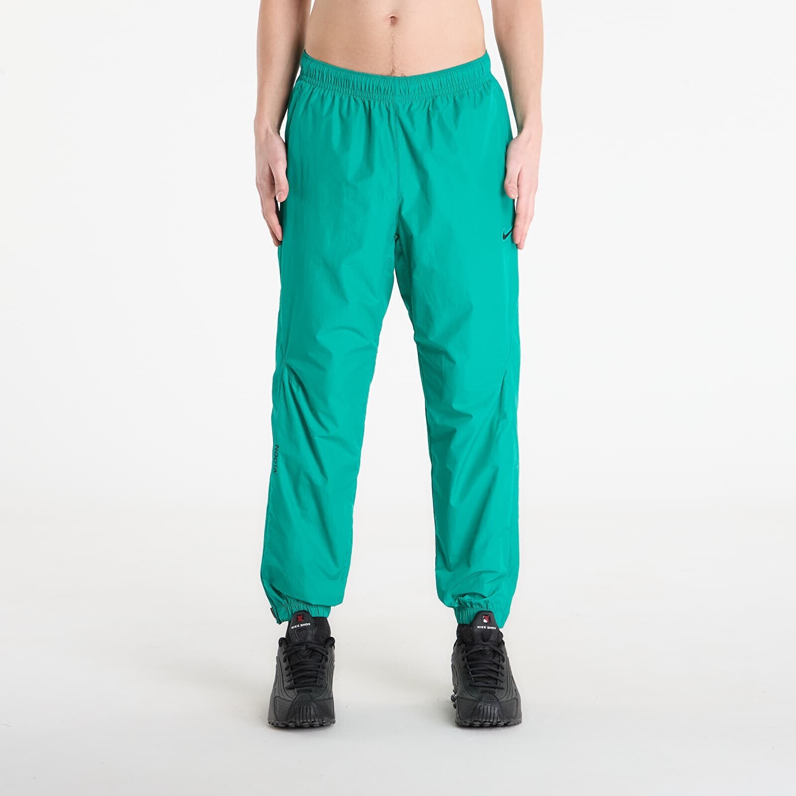 Kalhoty Nike x NOCTA Northstar Nylon Track Pants Neptune Green/ Neptune Green/ Black S