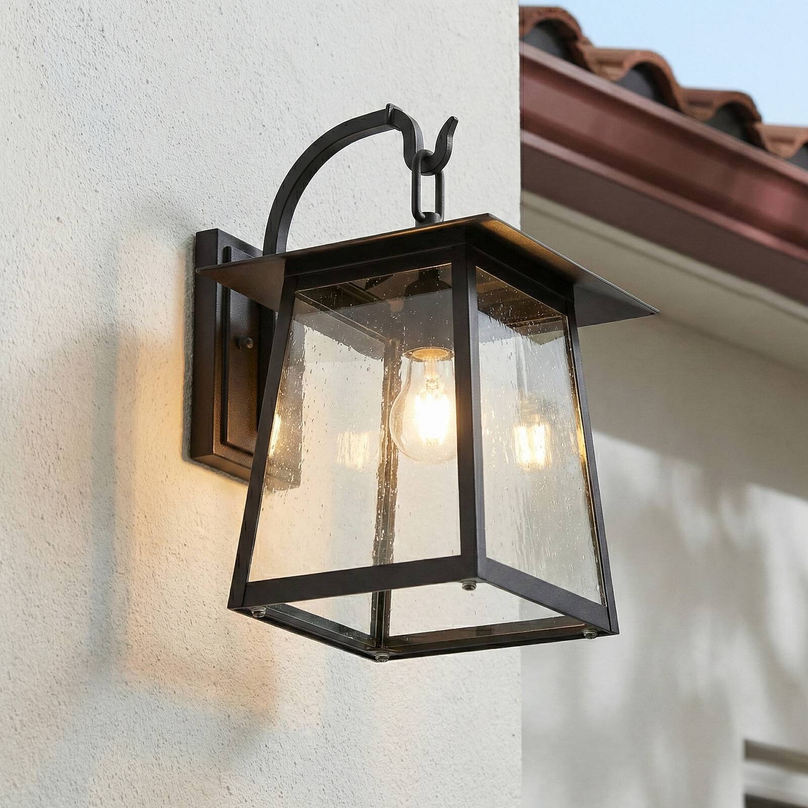 Lucande Vonkajšie nástenné svietidlo Xavon, čierne, lucerna, E27, IP44